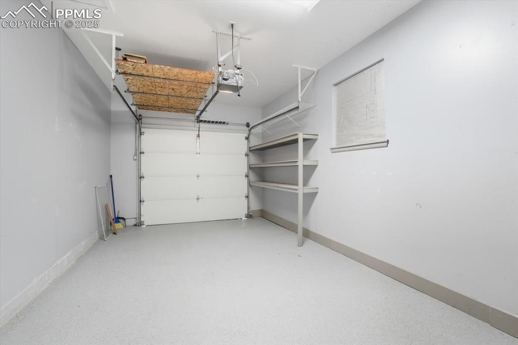 Image 25 of 30: 1 car garage attached to home