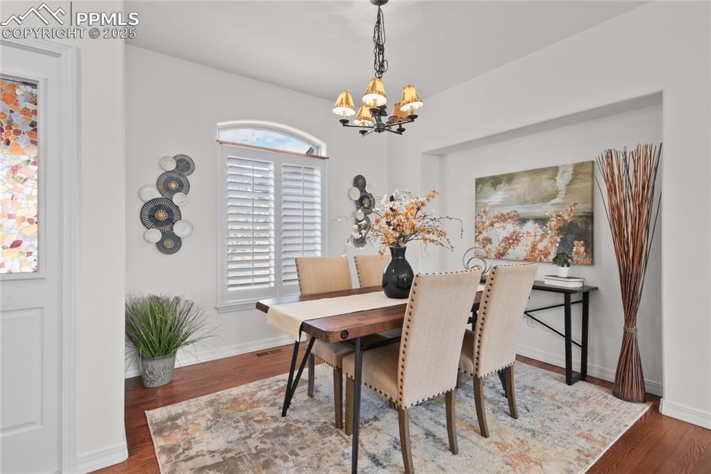 Image 13 of 50: Check out the plantation shutters throughout the main level. 