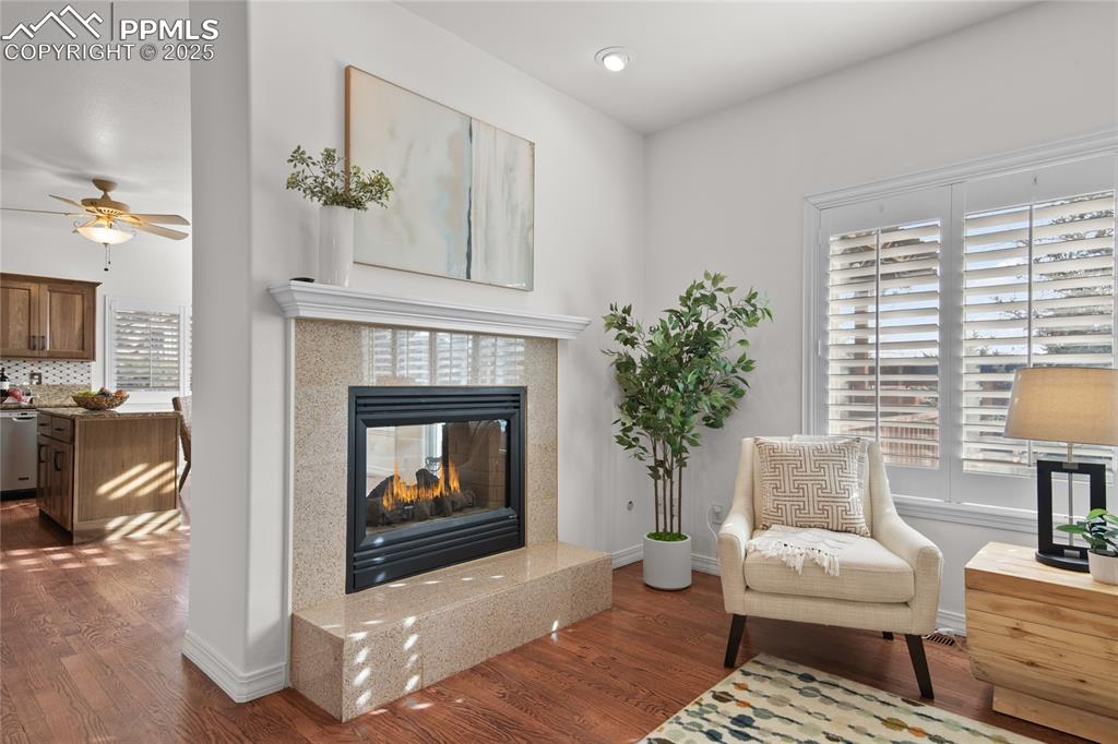 Image 14 of 50: Tons of natural light flow through the custom plantation shutters that are 