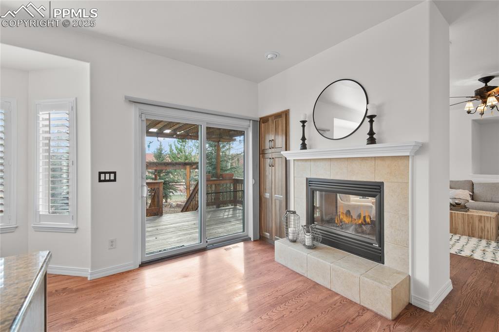 Image 15 of 50: Kitchen walks out to the deck through the newer sliding glass door. Double 