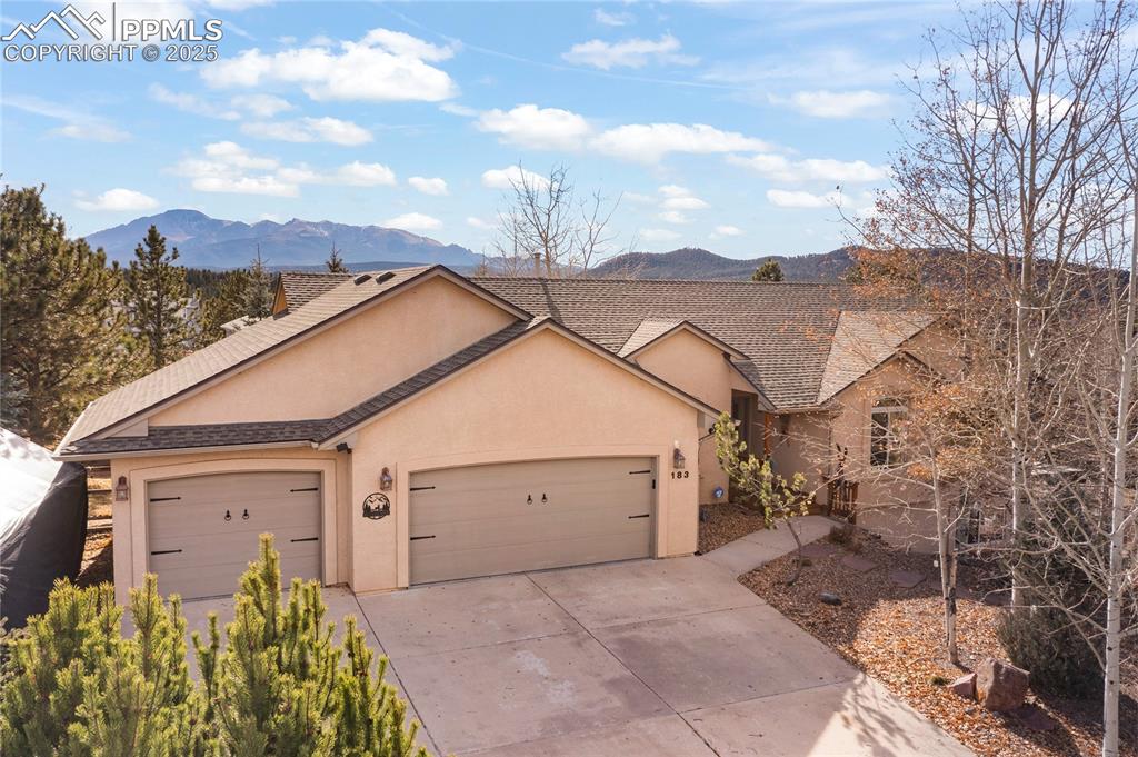 Image 2 of 50: Plenty of parking at with the large driveway and three car garage. Durable 