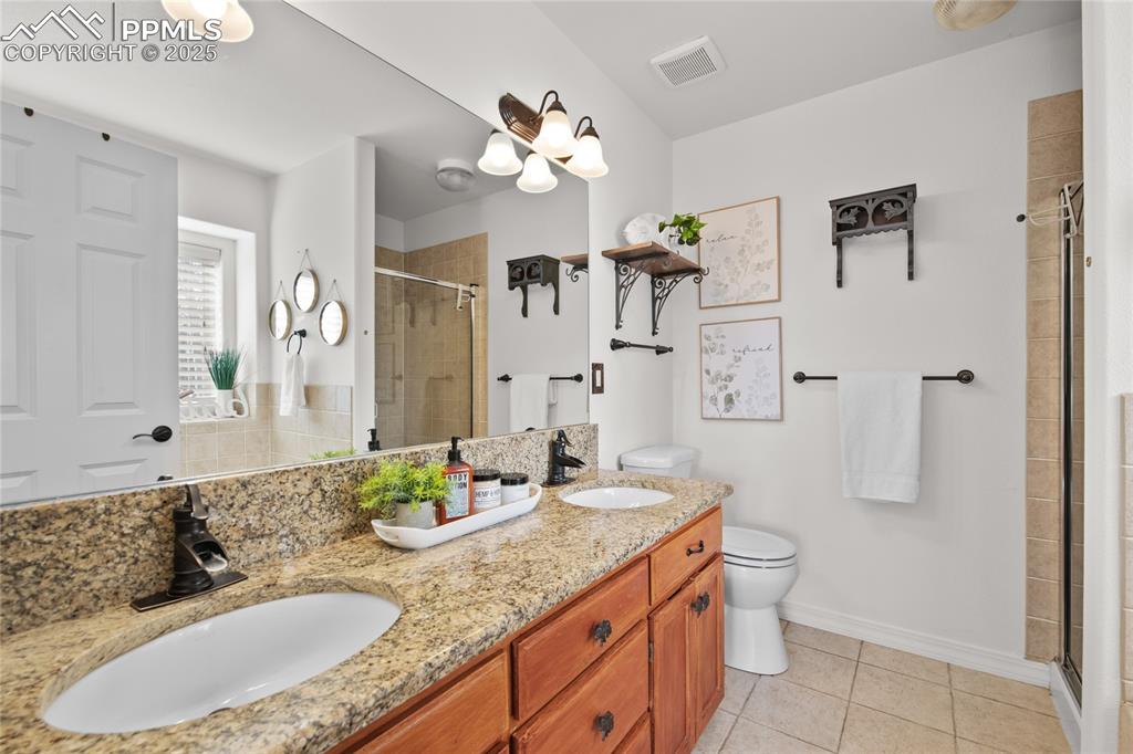 Image 27 of 50: Granite countertops in the 5 piece primary bath. Stand alone shower and tub
