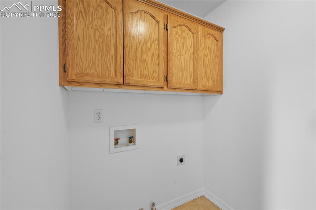 Image 33 of 50: Upstairs Laundry Room has electric and gas hook ups