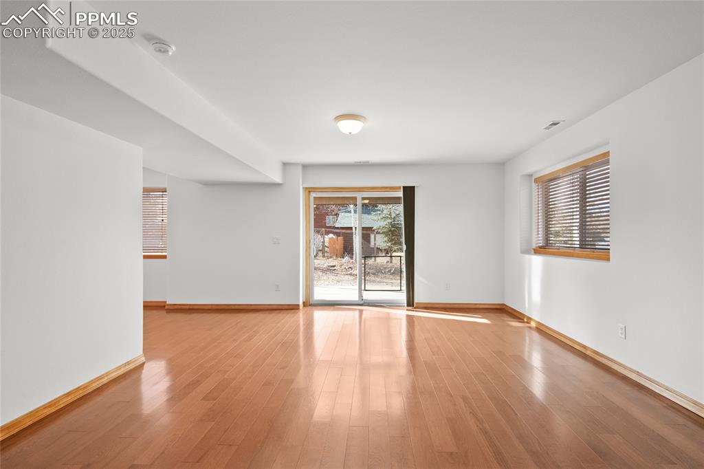 Image 36 of 50: Large family room in the basement with walkout to the back yard. 