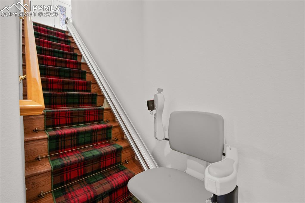 Image 37 of 50: Electric Chair lift is included with the home or it can be removed 