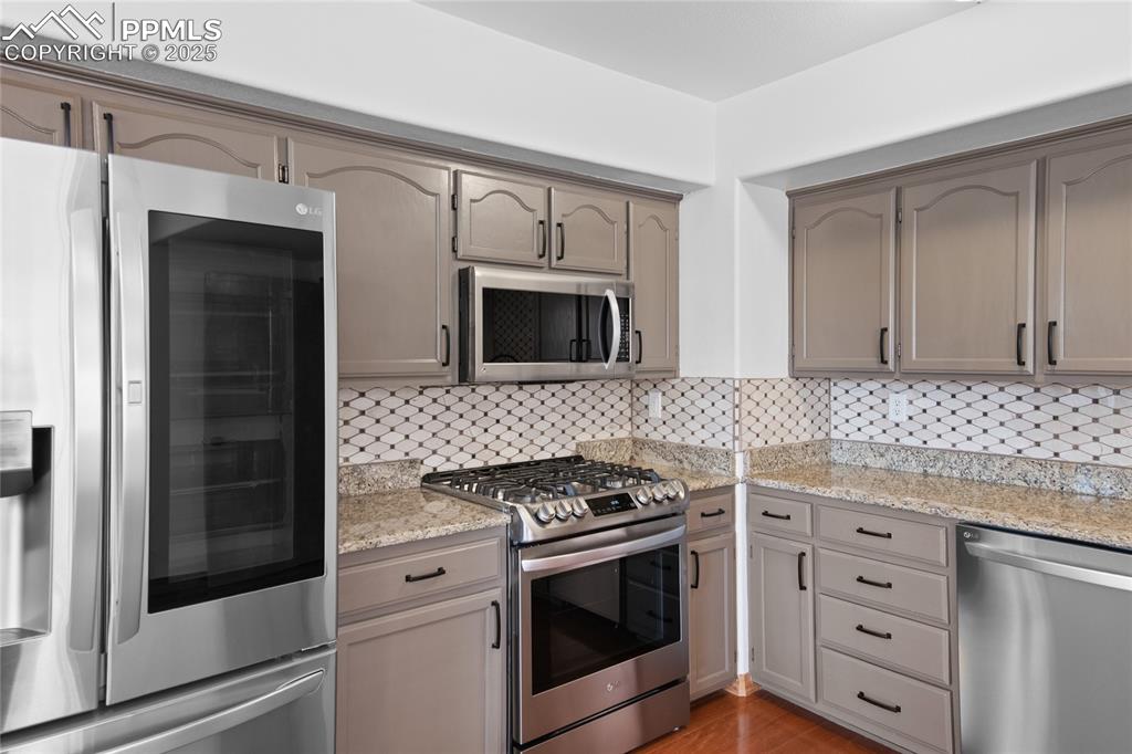 Image 40 of 50: LG appliances in the updated basement kitchen 