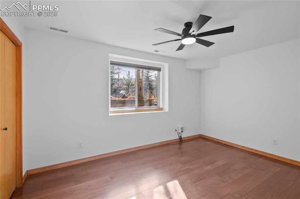 Image 41 of 50: Basement Bedroom. That think plugged into the outlet is the controls for th