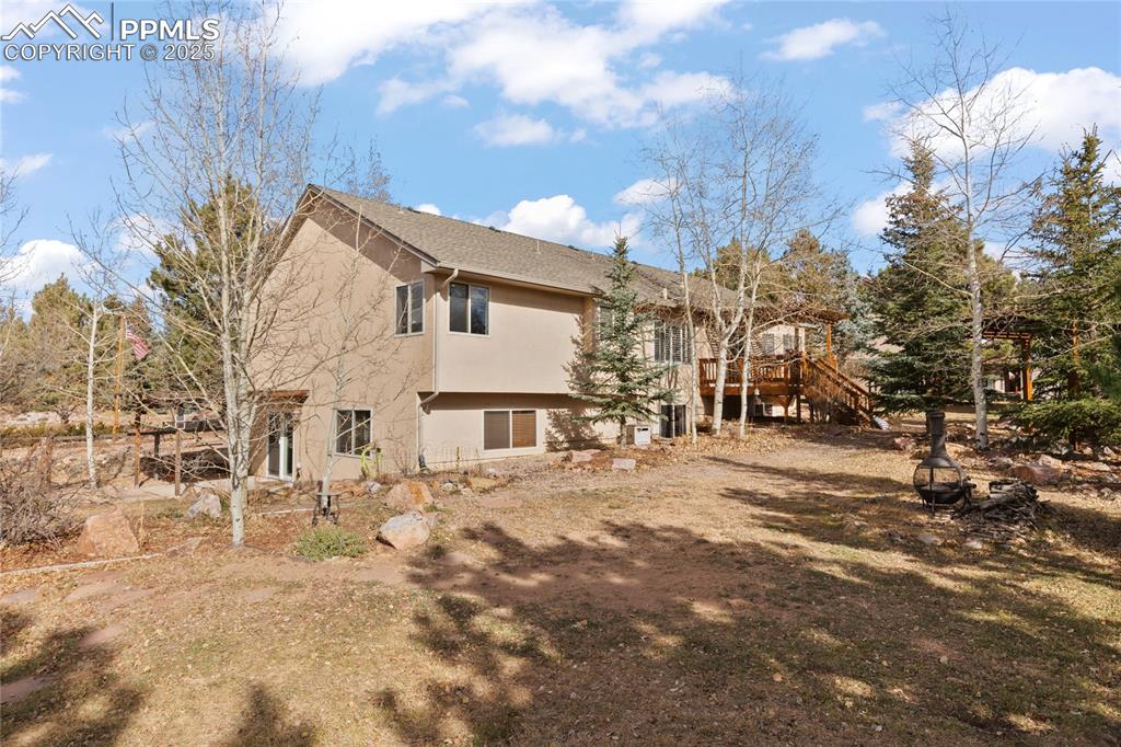 Image 48 of 50: Enjoy the freedom of a large back yard. Wait until you see the aspens in bl
