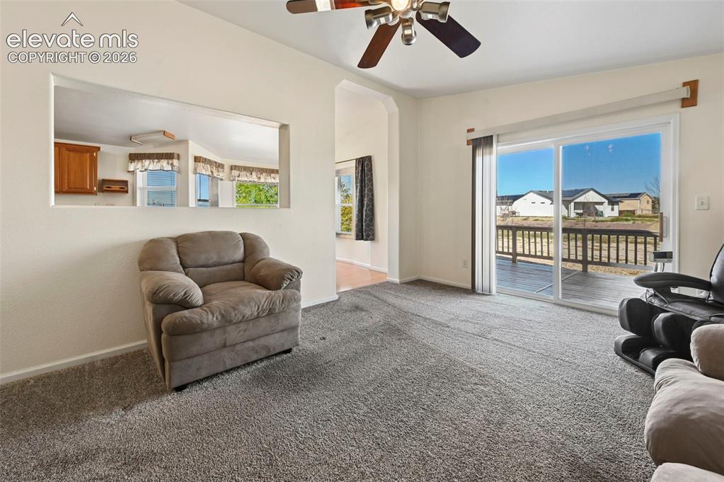 Image 16 of 50: Interior featuring neutral wall-to-wall carpeting, ceiling fan with integra