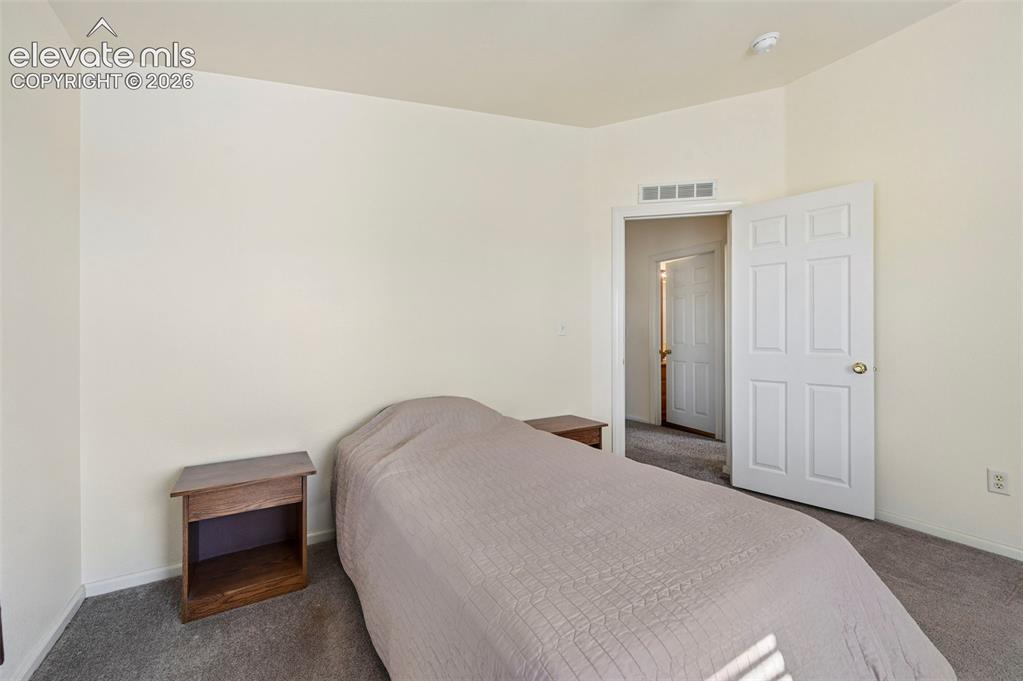 Image 34 of 50: Neutral interior featuring wall-to-wall carpeting and a traditional six-pan