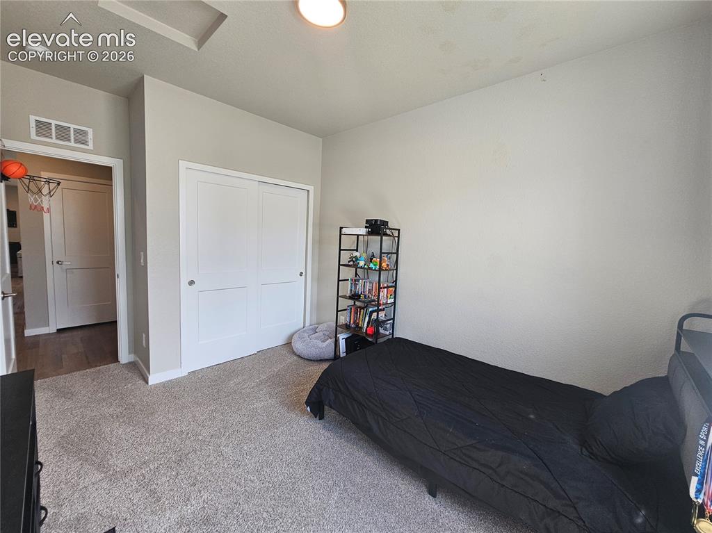 Image 7 of 35: Recessed ceiling feature, neutral wall paint, white sliding closet doors, a