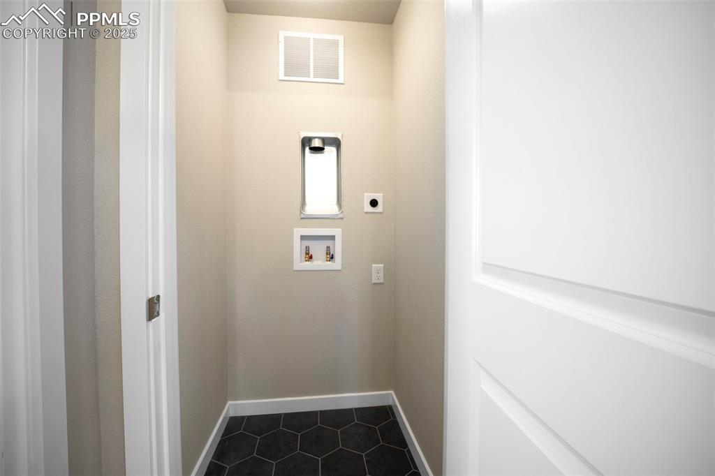 Image 38 of 47: Upper level multi-gen suite stackable laundry