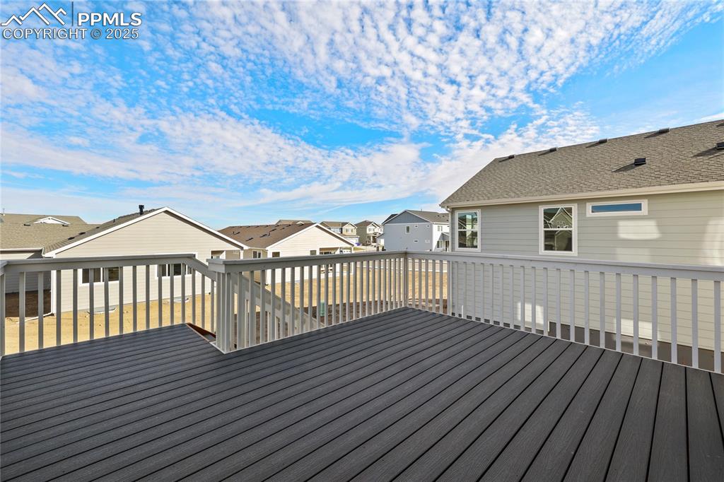 Image 4 of 25: Wooden terrace featuring a residential view