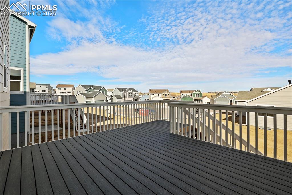 Image 5 of 25: Wooden deck featuring a residential view