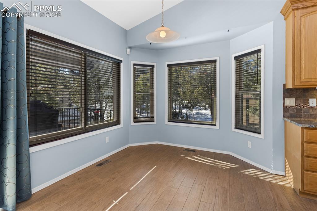 Image 20 of 50: Eat-in nook - with tile flooring flowing throughout