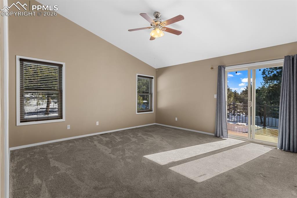 Image 24 of 50: Primary bedroom, walk out access