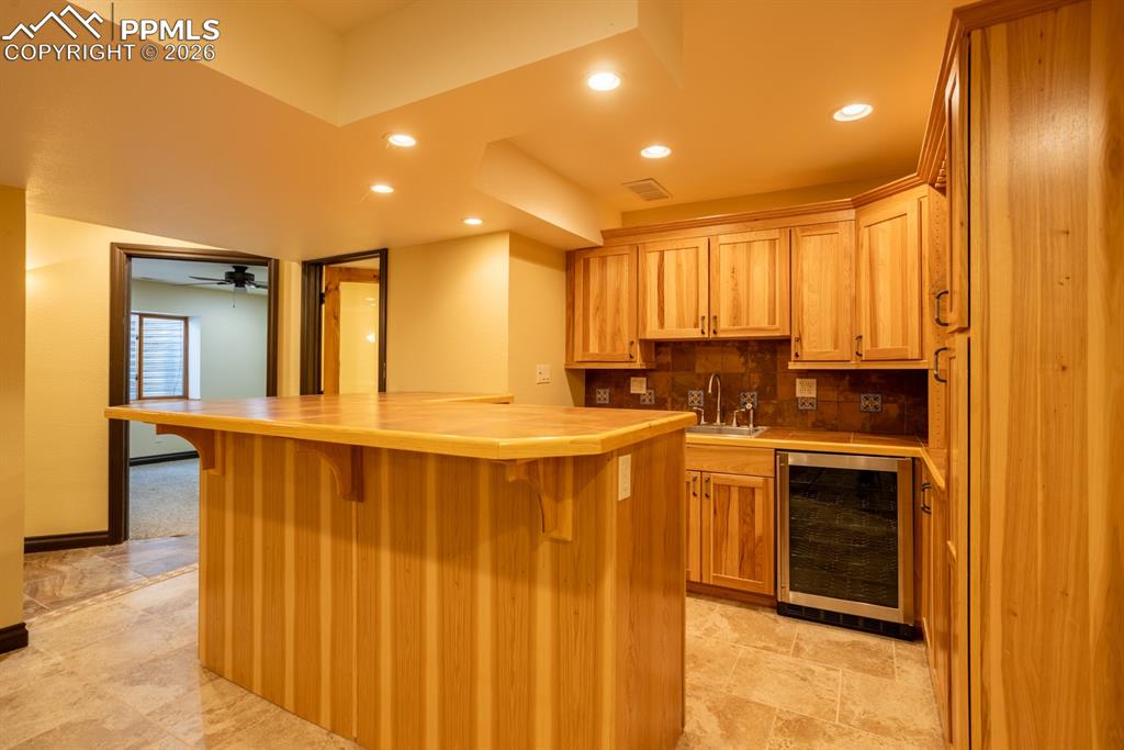 Image 36 of 50: Basement wet bar