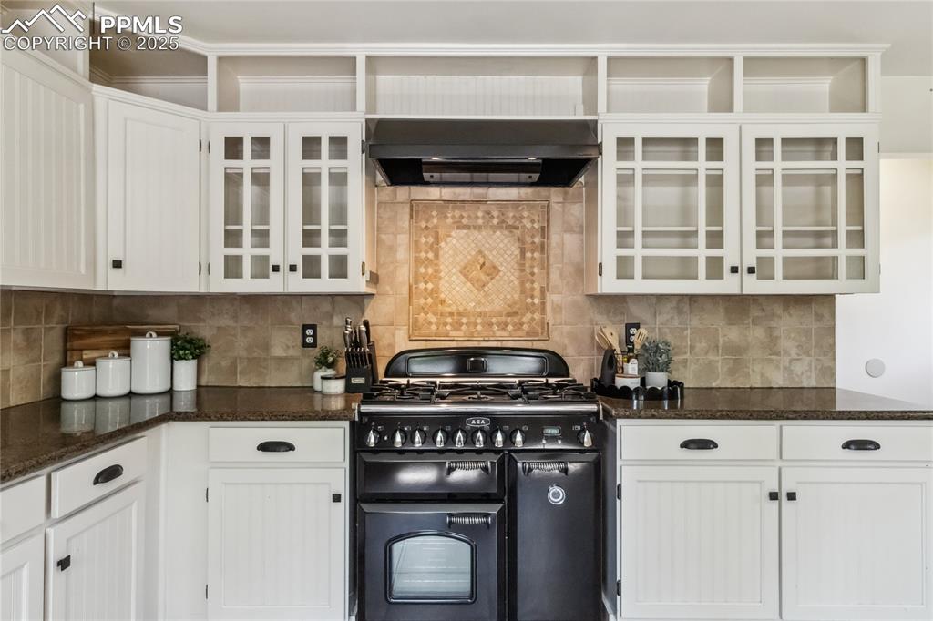 Image 13 of 49: Kitchen featuring AGA Legacy Multi-Function Gas Range & Glide out Broiler