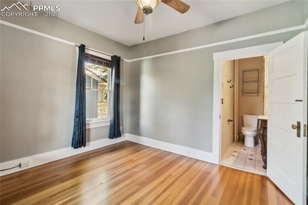 Image 19 of 49: Second bedroom with ensuite bathroom