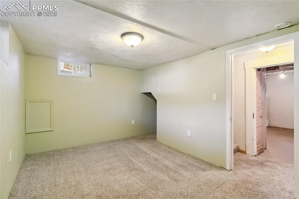 Image 23 of 49: Third bedroom in basement