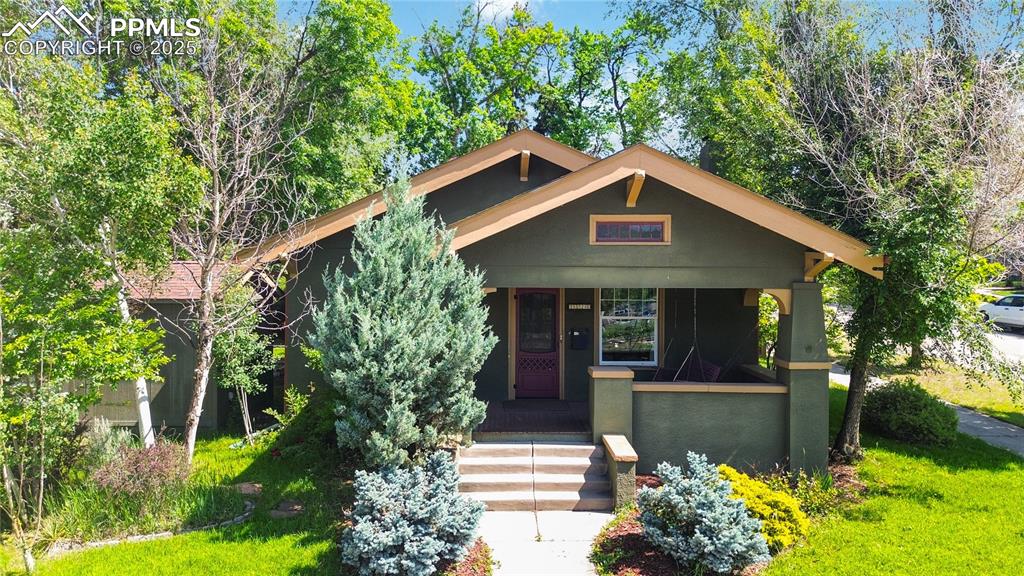Image 49 of 49: Front elevation of property with covered porch