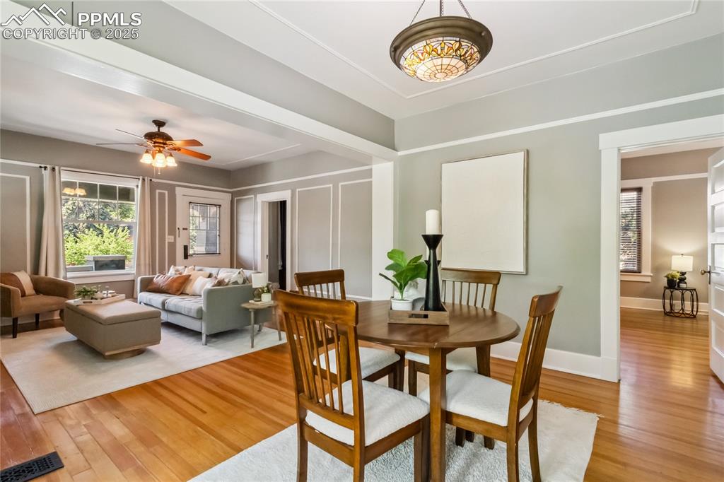 Image 8 of 49: Bright and open highlights original hardwood floors
