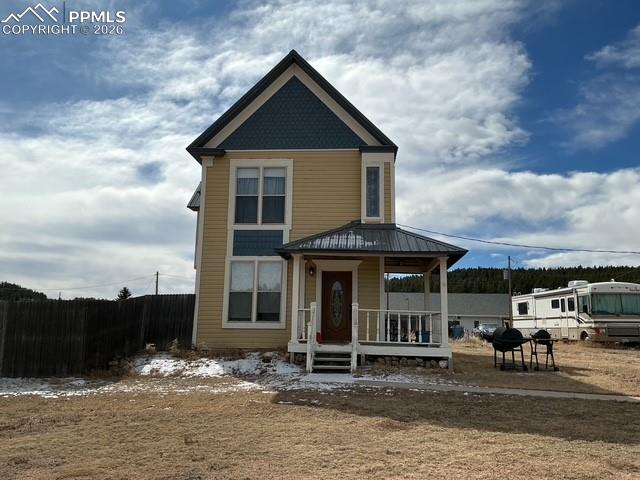 Image 3 of 36: View of front of home with covered porch