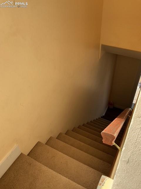 Image 33 of 36: Staircase featuring baseboards