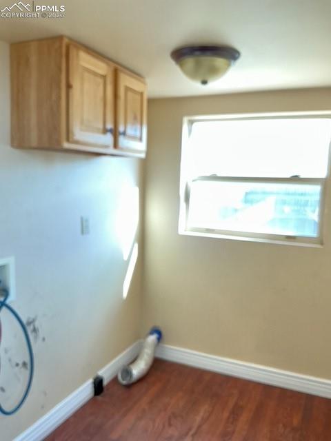 Image 35 of 36: Laundry room with cabinet space, dark wood-style flooring, and washer hooku