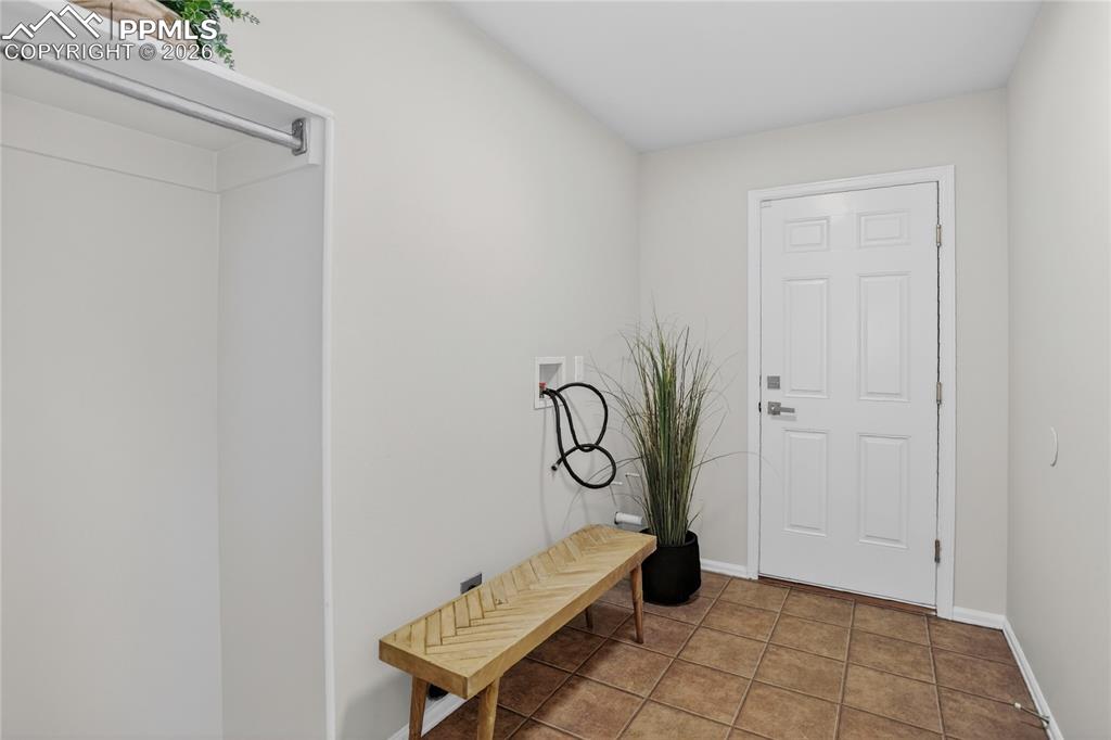 Image 11 of 29: Mudroom/laundry area