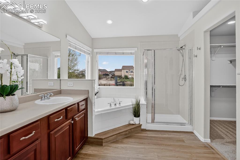 Image 15 of 29: 5-piece primary bath & walk-in closet