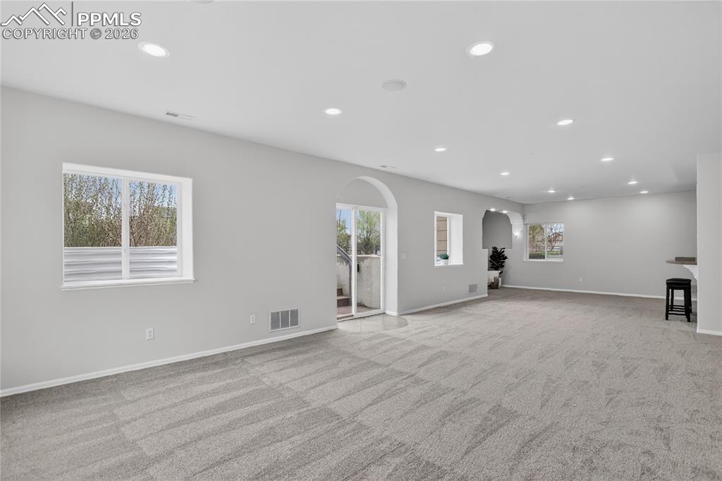 Image 20 of 29: Family room w/ walk-out - lower level