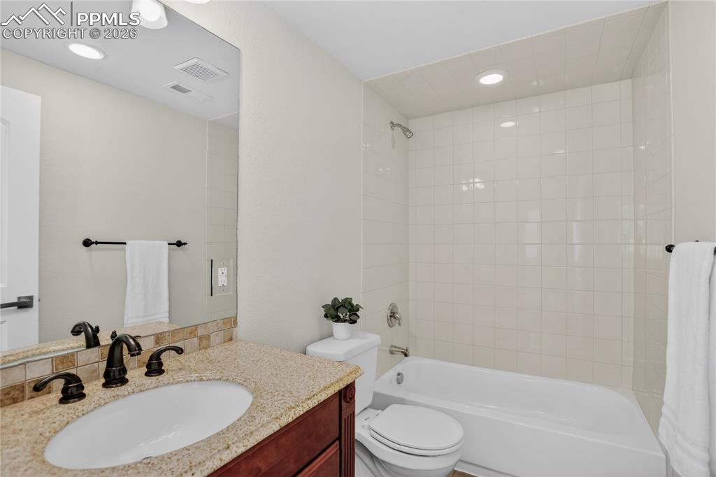 Image 25 of 29: Full guest bath - lower level