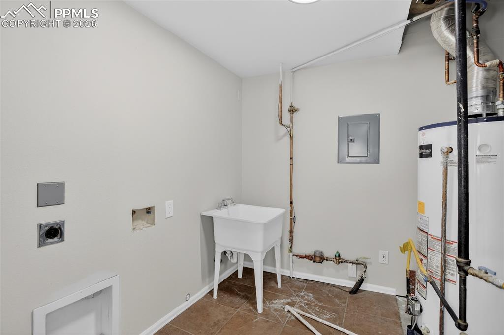 Image 26 of 29: Second laundry area - lower level