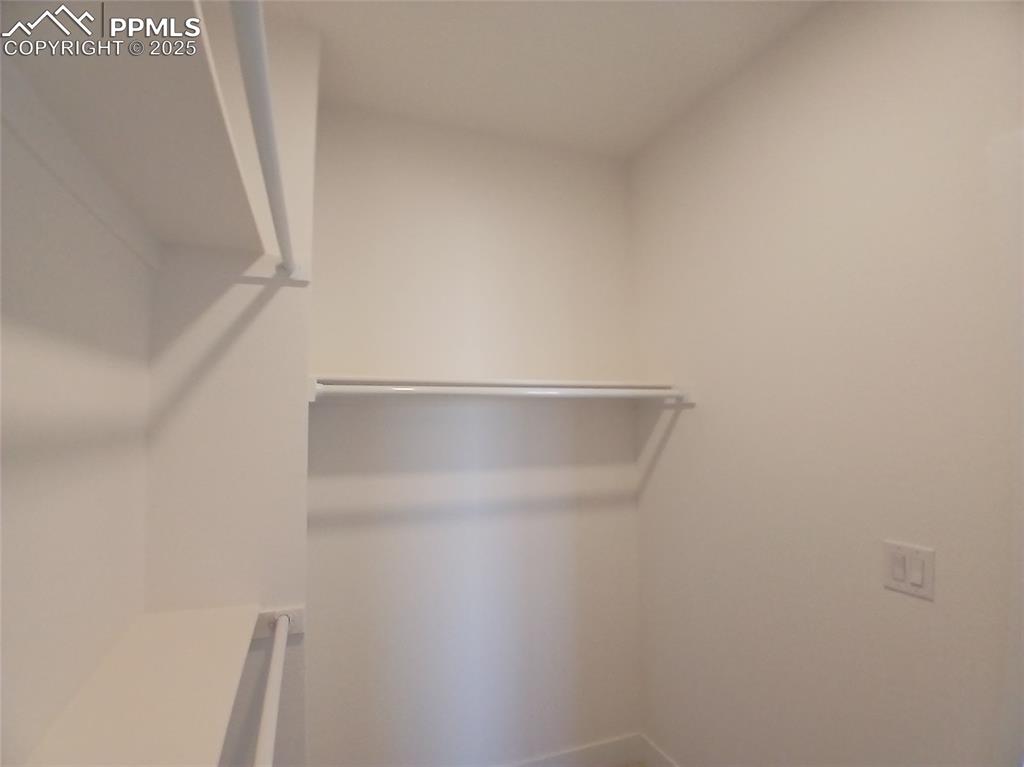 Image 18 of 39: Walk-in closet.