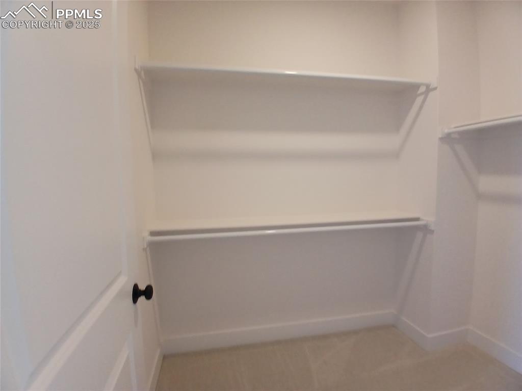 Image 19 of 39: Walk-in closet.