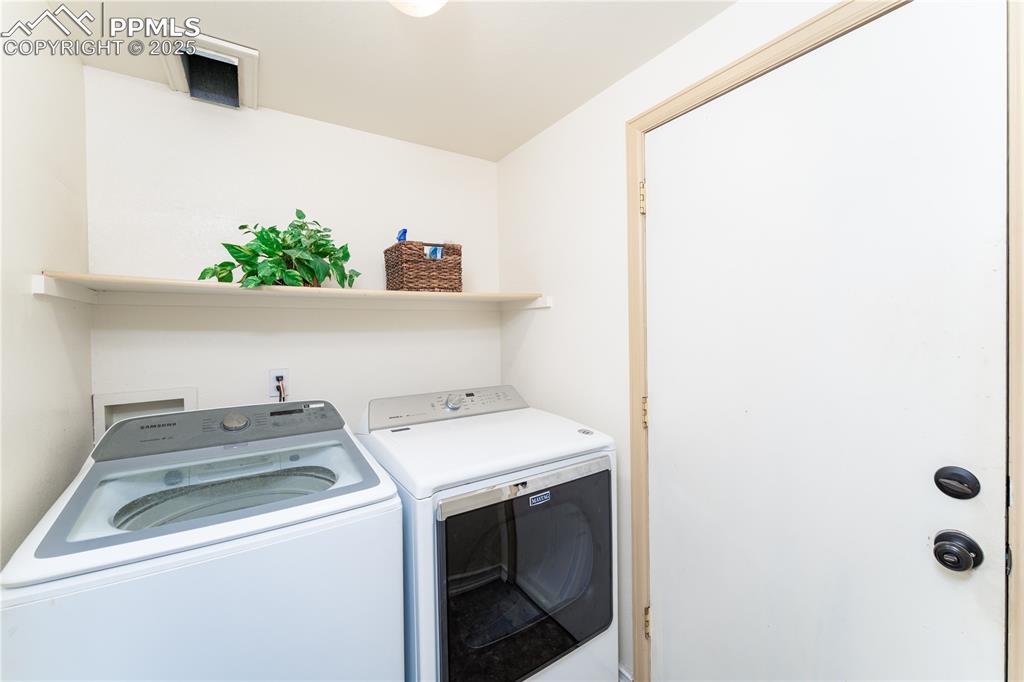 Image 13 of 34: Main level laundry