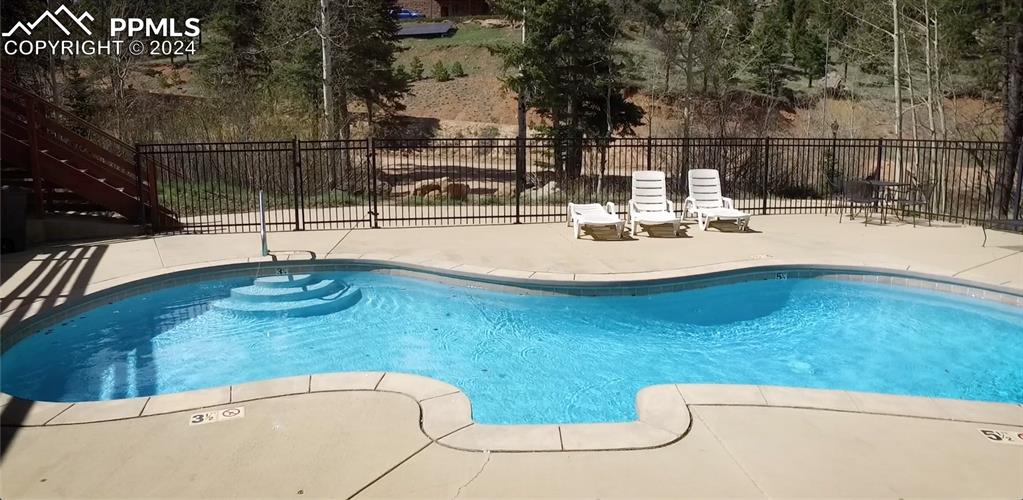 Image 22 of 22: Community Pool!!! No less, it is heated and open from Memorial Day through