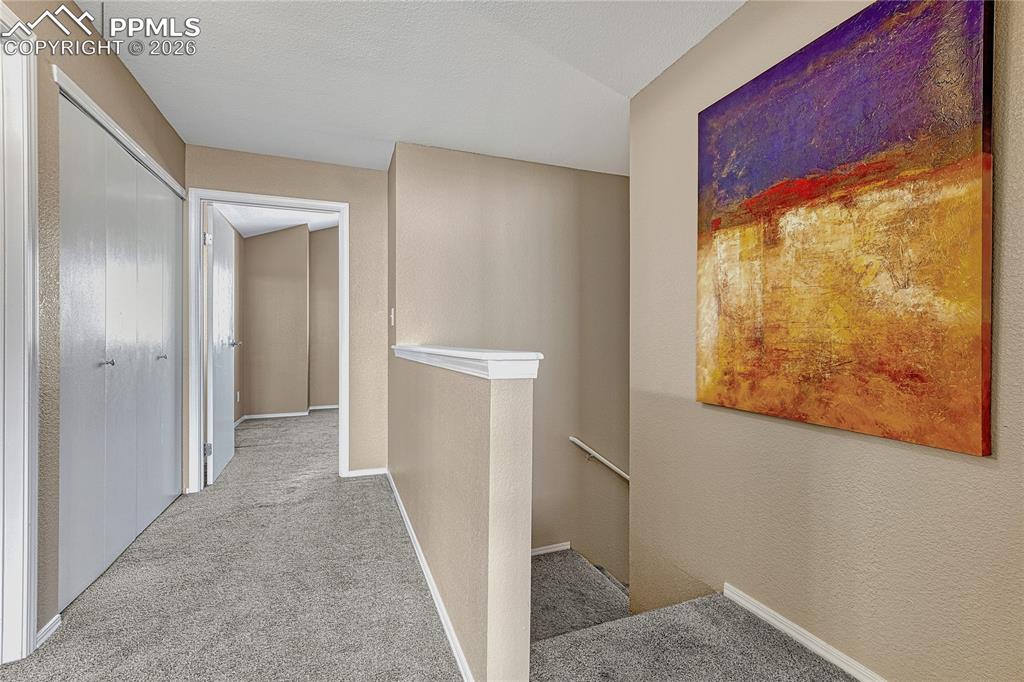 Image 25 of 47: Stairs to Attached Garage