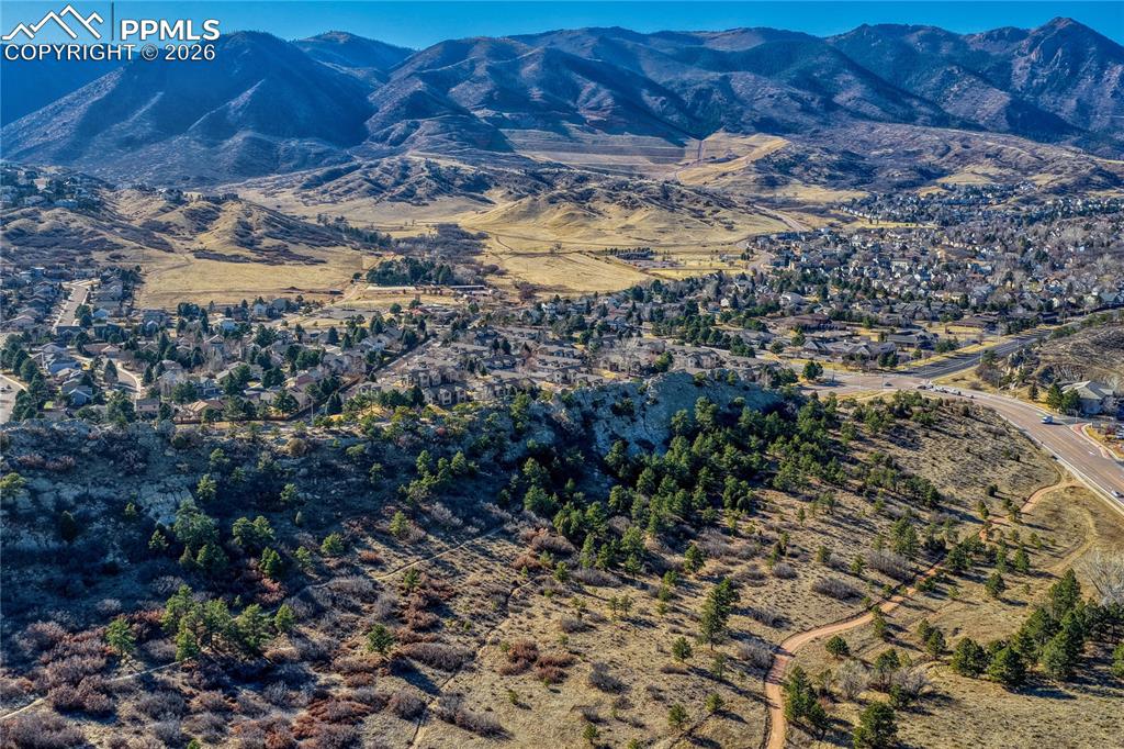 Image 42 of 47: Ute Valley Open Space with Arbors at Mountain Shadows behind, and the Front