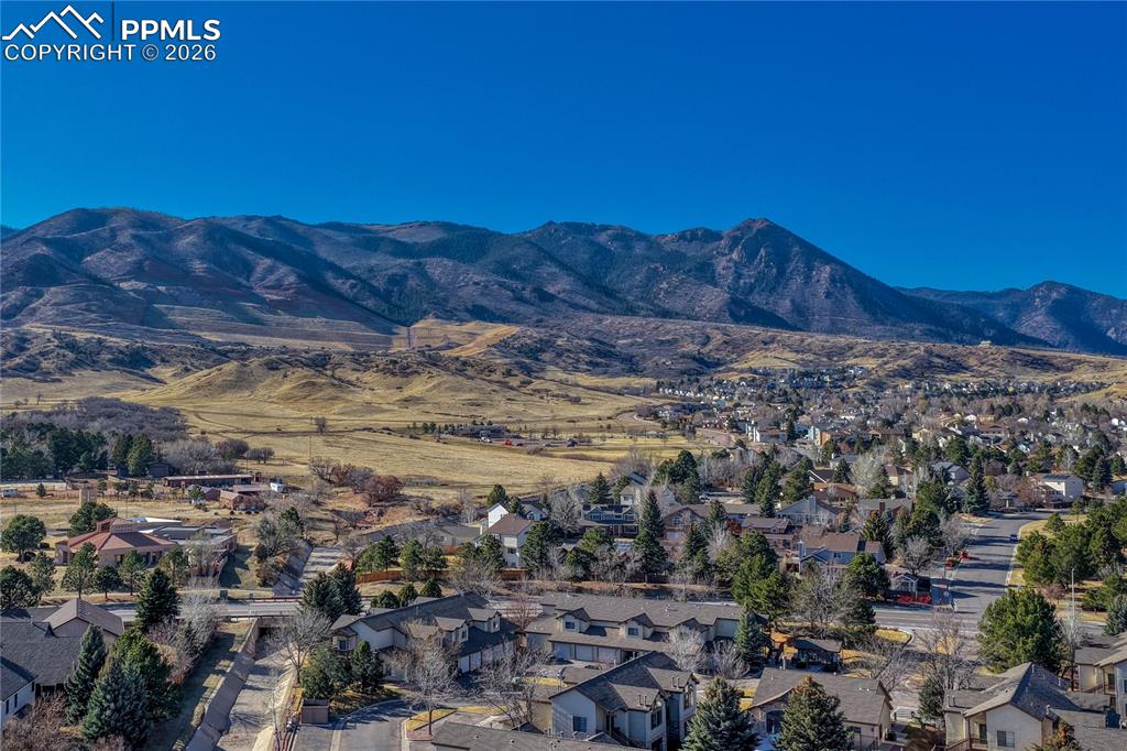 Image 43 of 47: The Arbors at Mountain Shadows with the Rockies on the background.