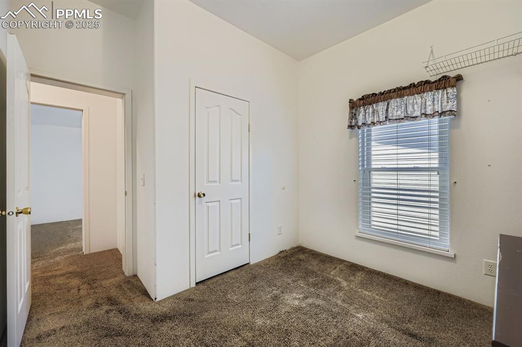 Image 22 of 29: Unfurnished bedroom featuring carpet floors and a closet
