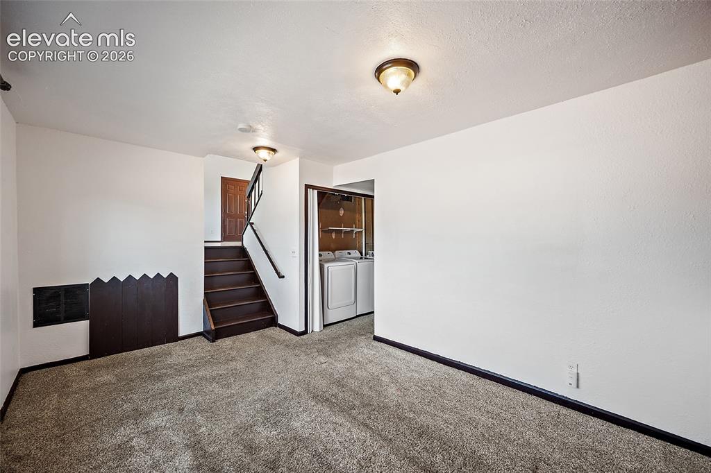 Image 17 of 37: Lower level family room.
