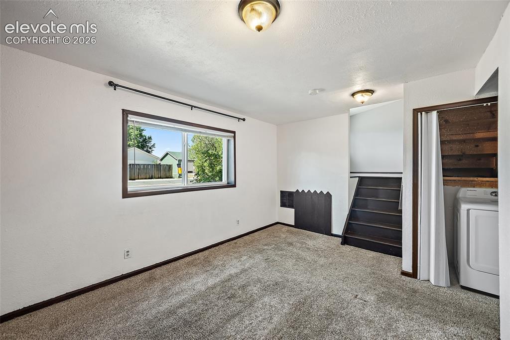 Image 18 of 37: Lower level family room.