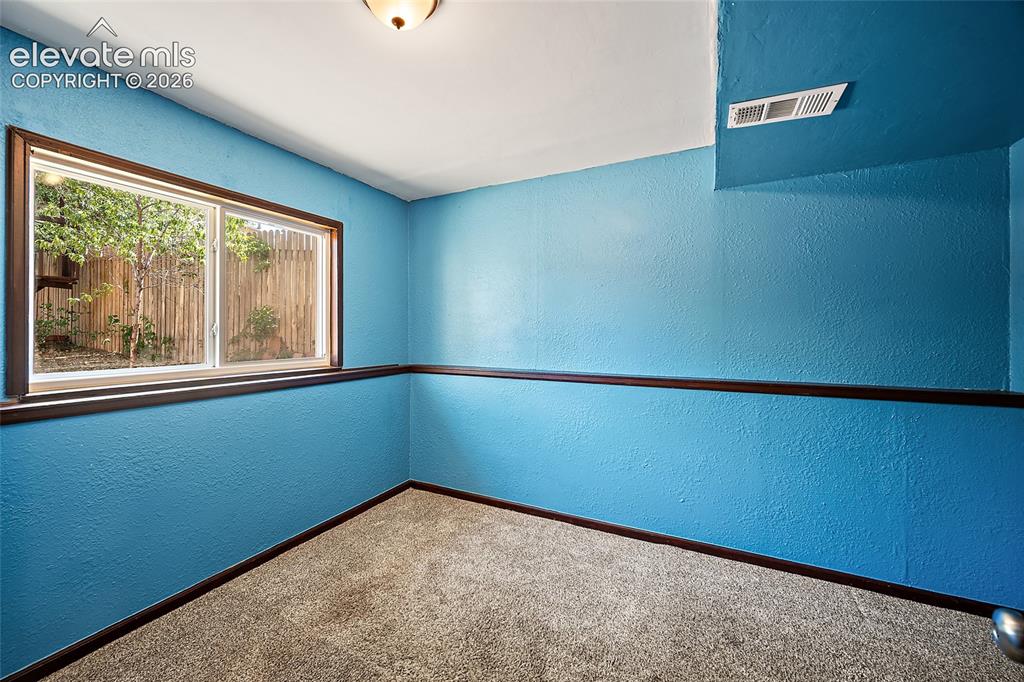 Image 19 of 37: Lower level bedroom.