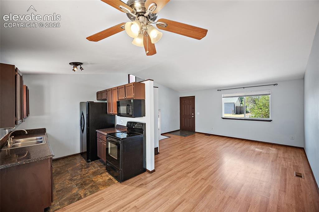 Image 3 of 37: Main level living room and dining area.