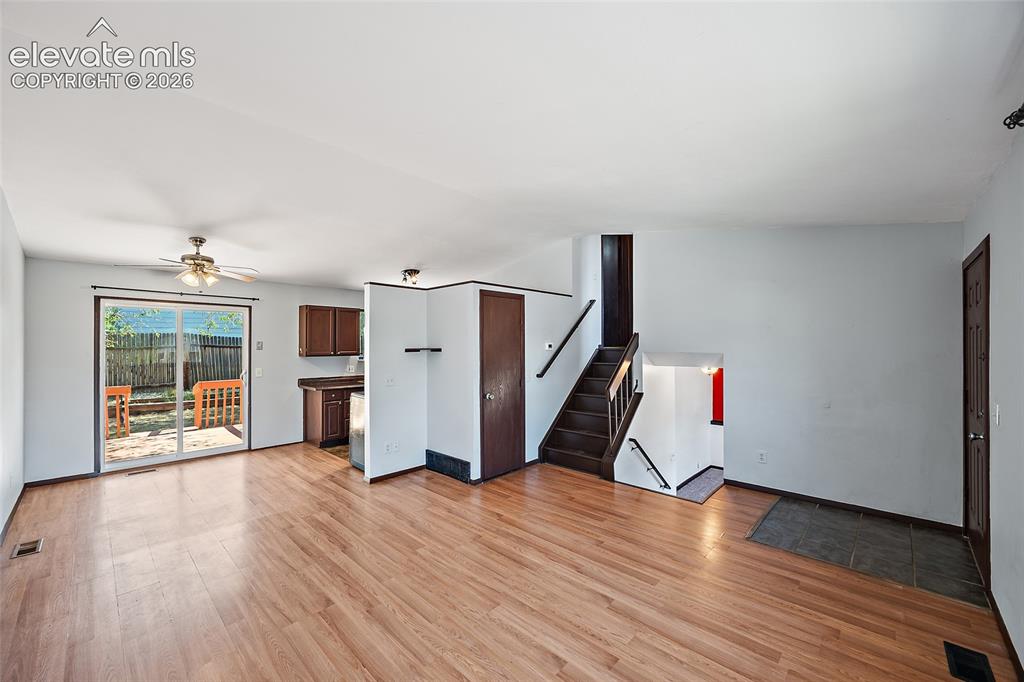 Image 4 of 37: Main level living room and dining area.