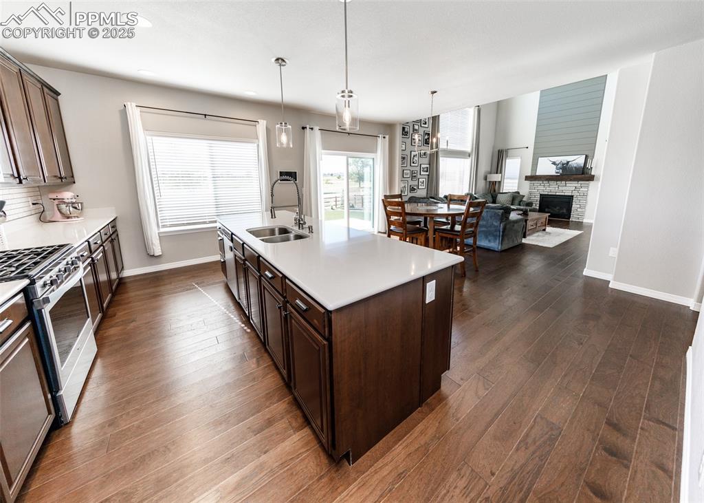 Image 12 of 43: A view from the kitchen into the breakfast area into the great room. This i