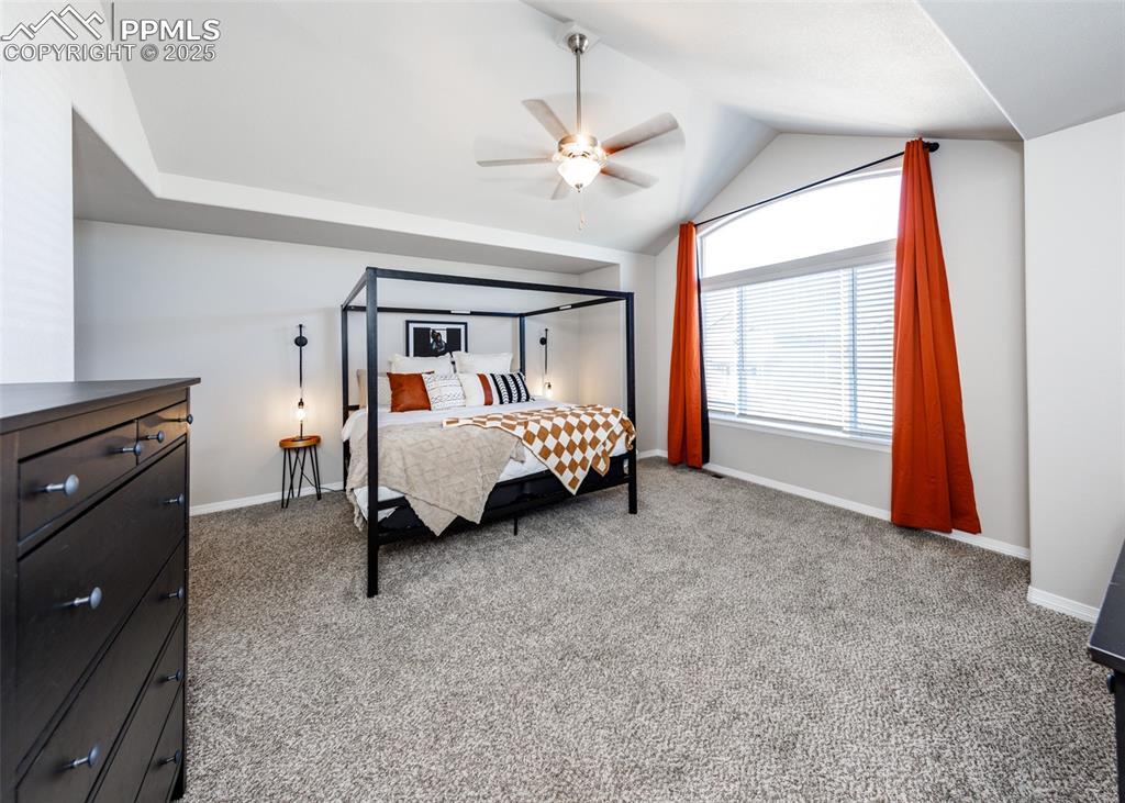 Image 18 of 43: Expansive Primary bedroom with vaulted ceiling for extra light.