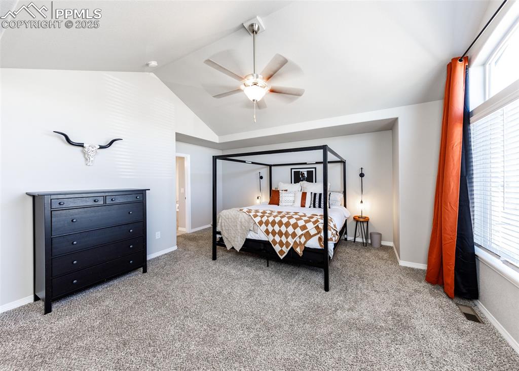 Image 19 of 43: Another view of the primary bedroom. Lots of room for Any bedroom suite fur